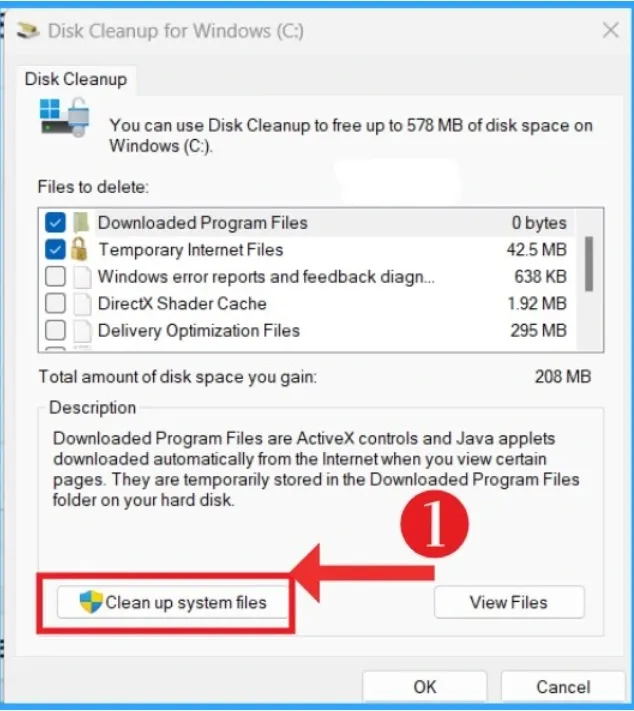 Windows 11 Disk Cleanup window showing the Clean up system files button.