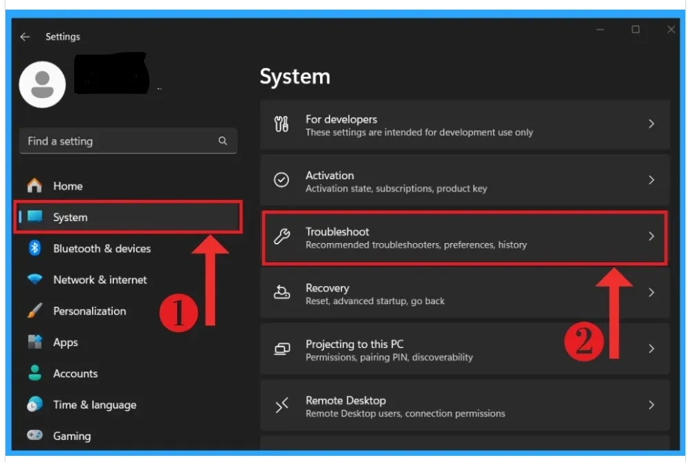 Windows 11 Settings showing System and Troubleshoot options.